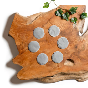 A package of six Lotus Vita limescale pads for water filters, designed to reduce mineral buildup.